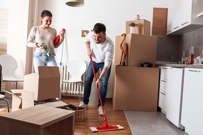 couple cleaning apartment