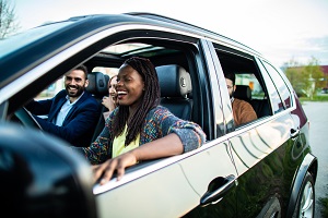 family sitting inside suv