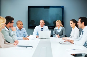 people gathered around a meeting table