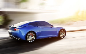 blue sports car driving on urban scene