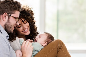 parents holding newborn