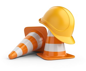orange cones and a yellow hard hat
